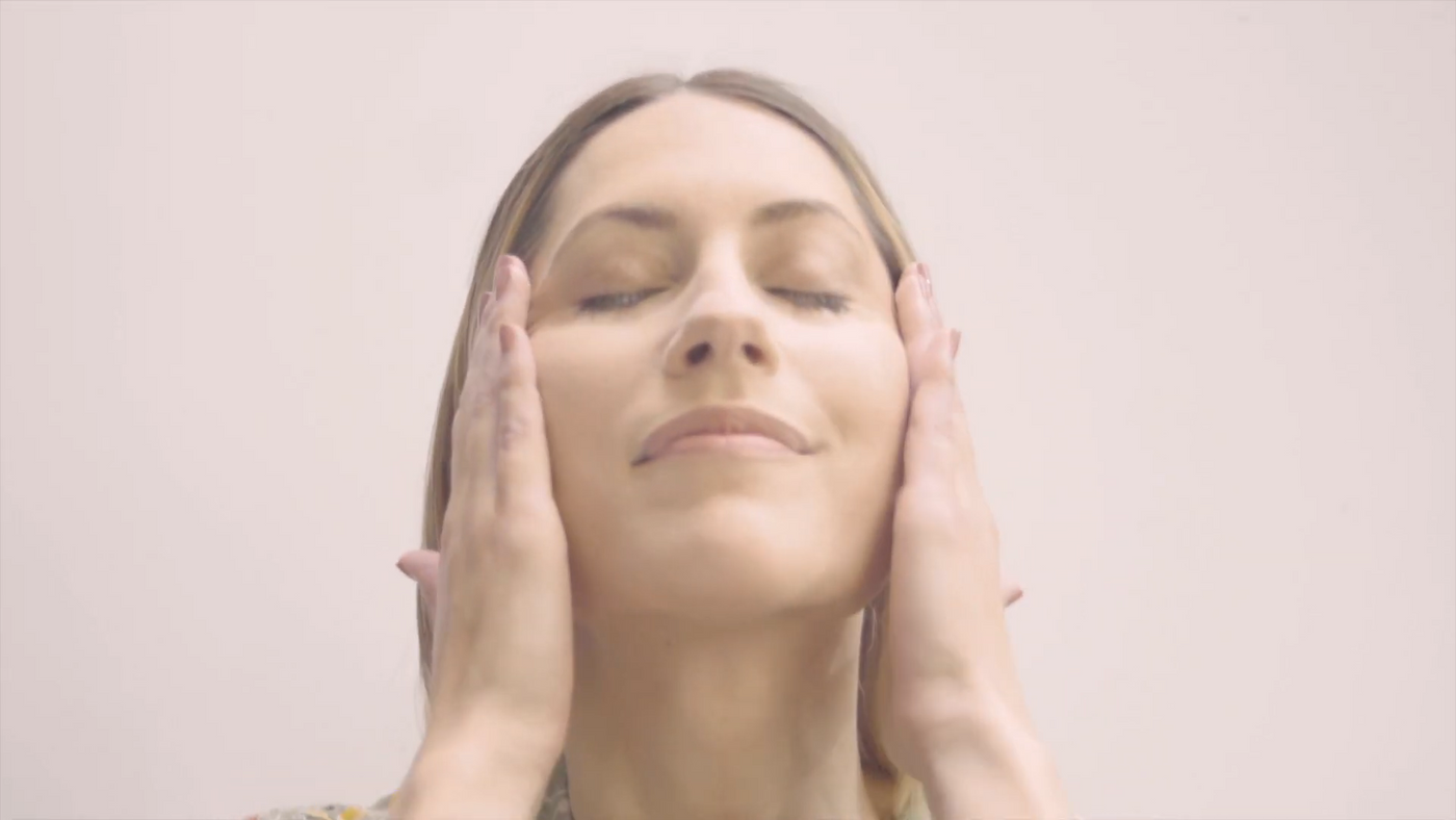 Lady Applying Nakin Skincare Products to Her Face